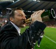 Belgium's soccer team coach Wilmots celebrates with champagne after a 2014 World Cup qualifying soccer match against Wales in Brussels
